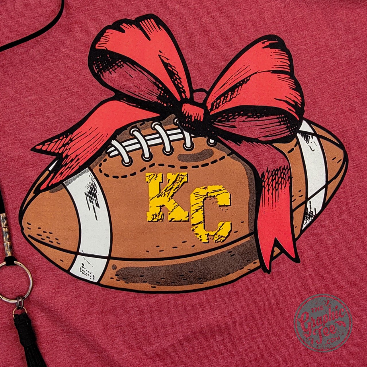 KC Football Bow Heather Cardinal Short Sleeve Crewneck Tee - The Graphic Tee